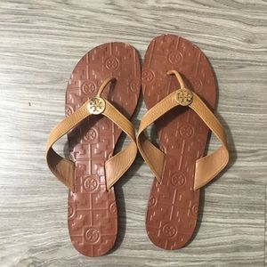Tory Burch gold leather flip flops